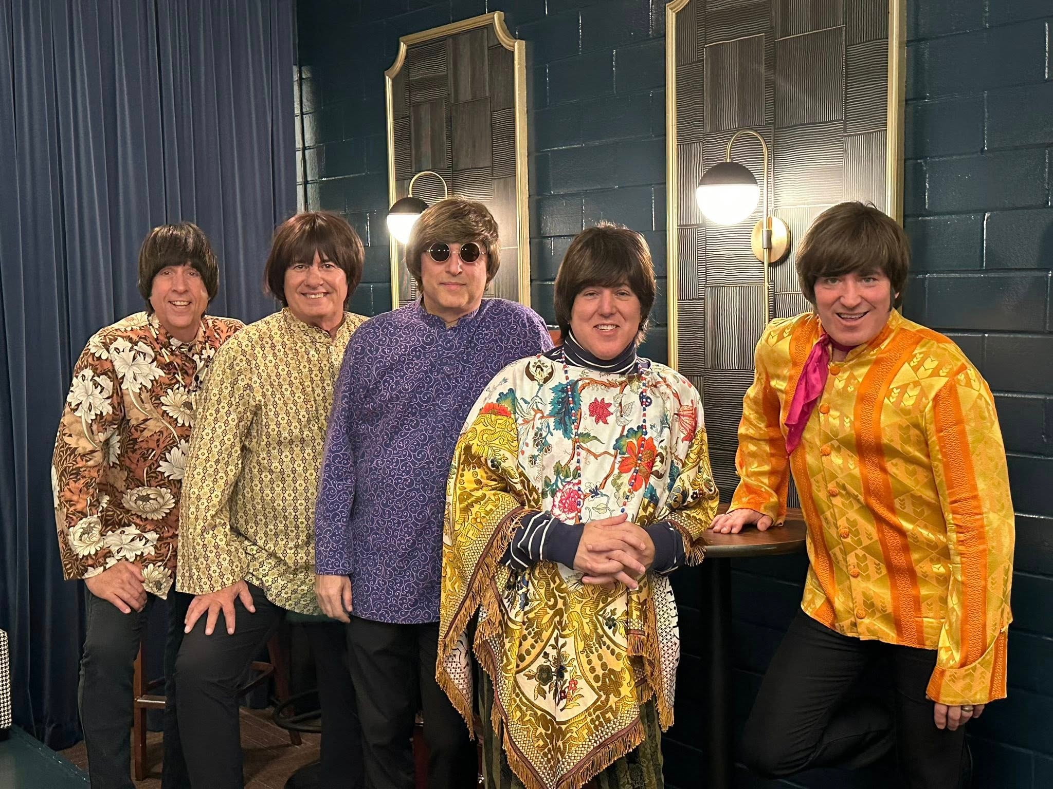 The Fab 5 backstage in colorful patterned jackets