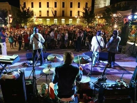 Fab 5 performing outdoors to a large crowd