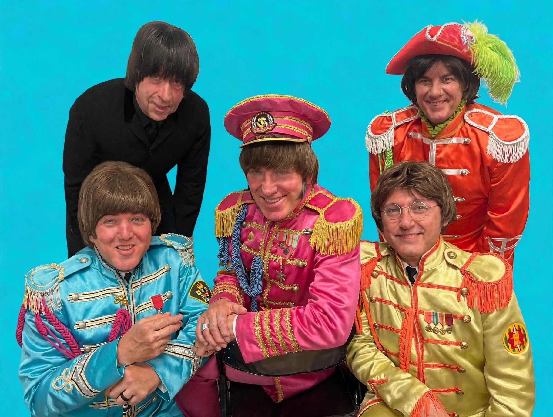 The Fab 5 in colorful Sgt. Pepper military costumes against turquoise background